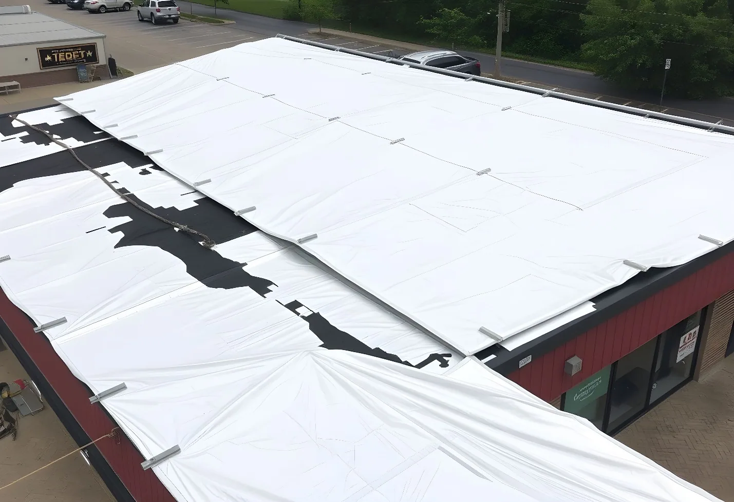 Crew repairing a commercial roof